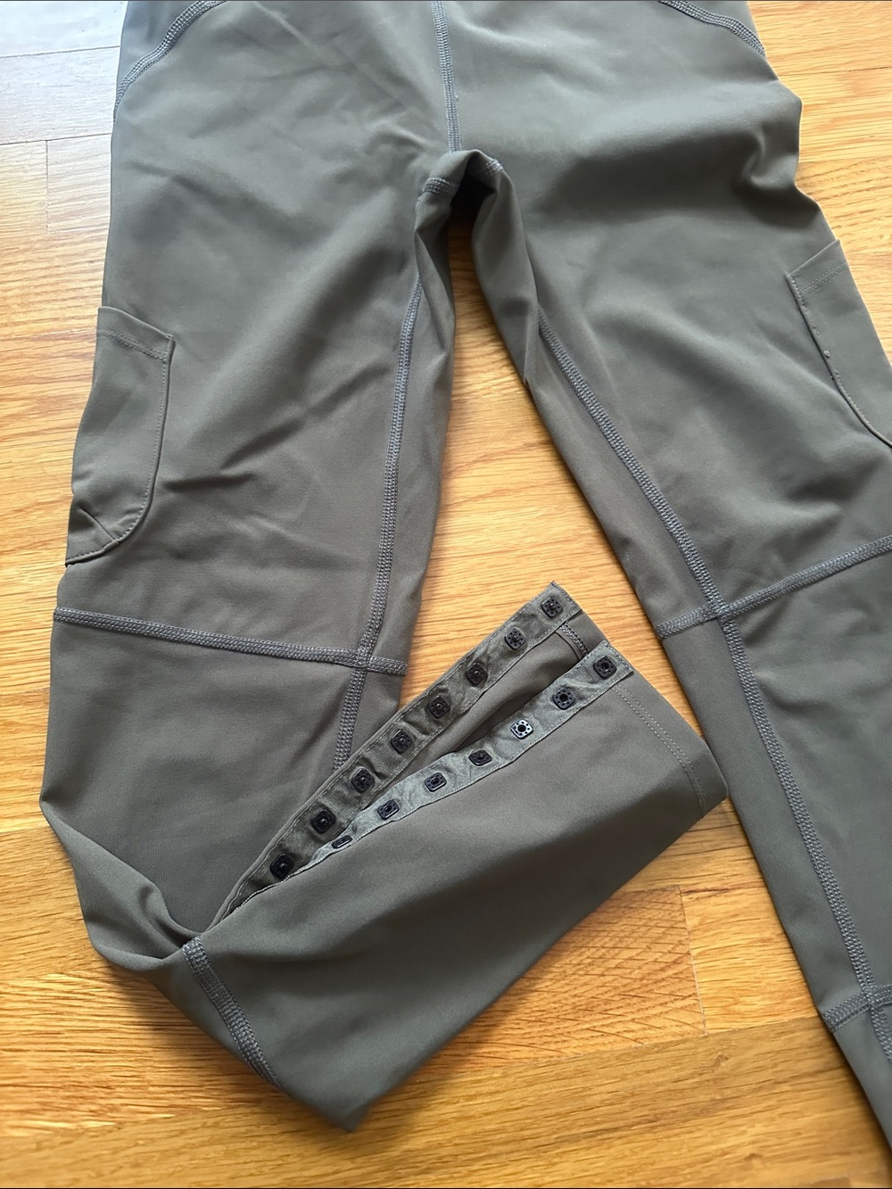 Free People- olive green leggings w/ snaps at bottom of legs, size XS